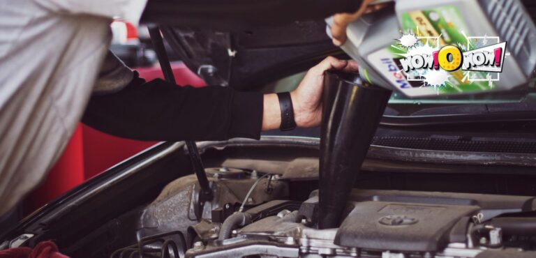 Fresh engine oil being poured into a car