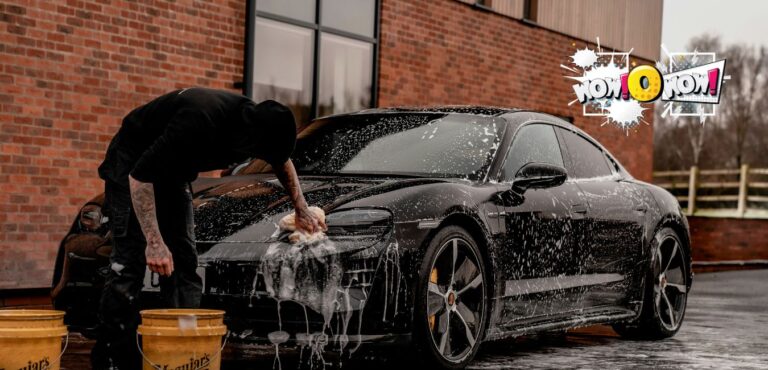 Person hand-washing a car